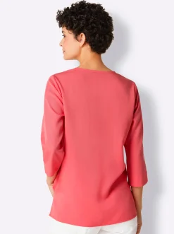 Druckbluse , am Saum hinten modisch länger