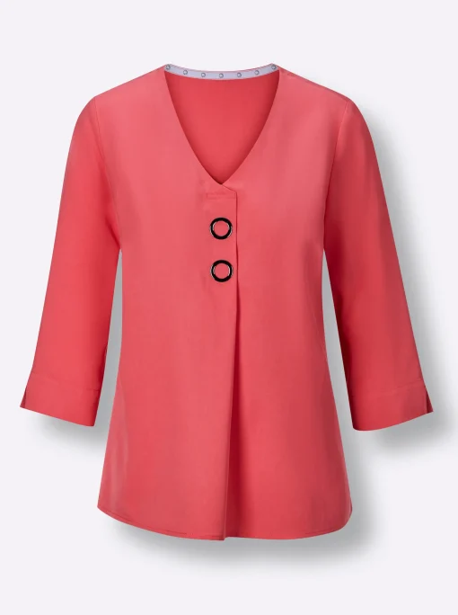 Druckbluse , am Saum hinten modisch länger